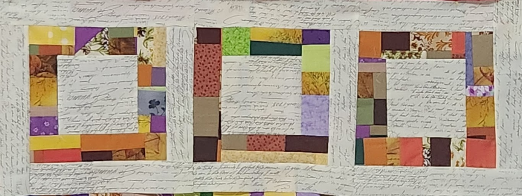 Three August blocks--off-white fabric used in center and final round.