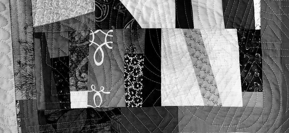 black and white photo showing straight line ruler work quilting 