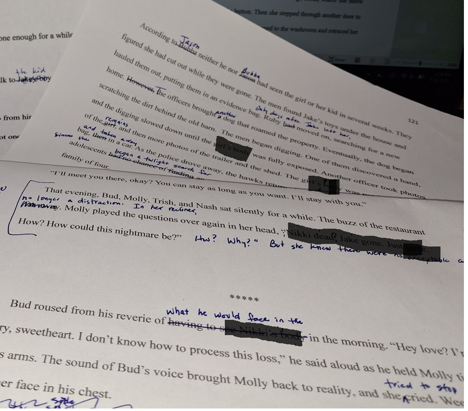 Pages of writing that have editing comments and redactions.