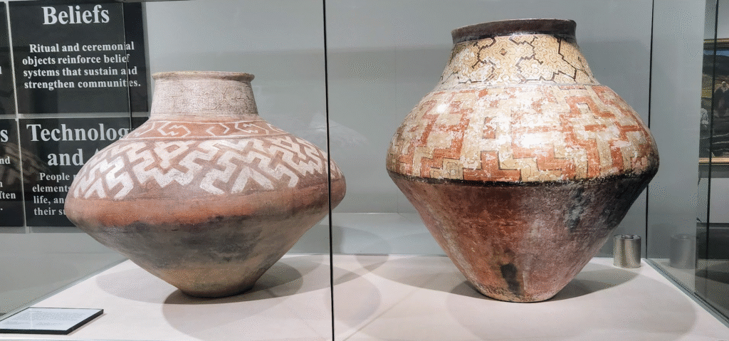 Two old vases on display at a museum in Broken Bow, AR.