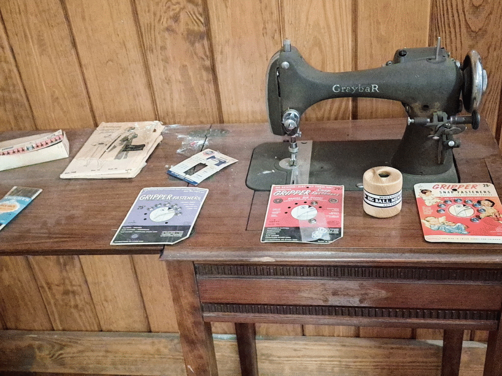 A Graybar sewing machine set in an ornate table. 