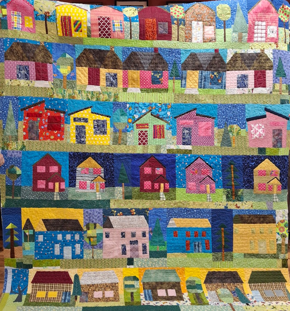 Mary's house quilt from the 2025 CQG block of the month. Not bound here, but it is now. I simply need to add the label and will then write a post about it.