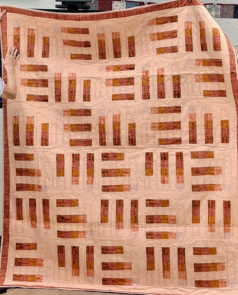 Red and pink-orange modern quilt.